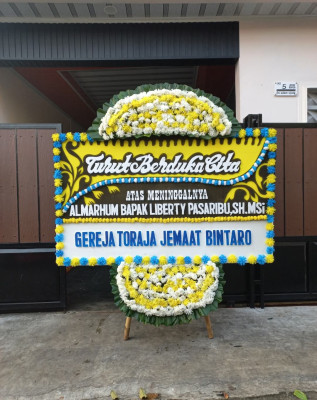 Papan Bunga Duka di Sisik